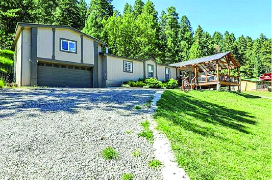 54 Wimsatt Loop — photo as printed in The Real Estate Roundup