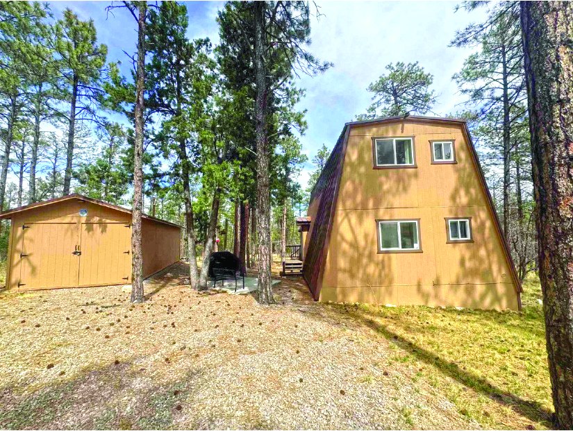 2 Bedroom 2.0 Acre Property — photo as printed in The Real Estate Roundup